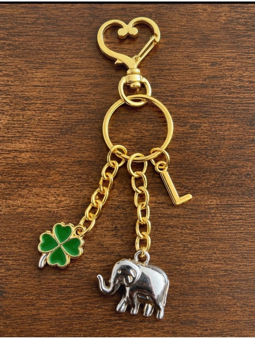 Gold Tone Keychain with Custom Letter, Four-Leaf Clover, and Elephant Charms